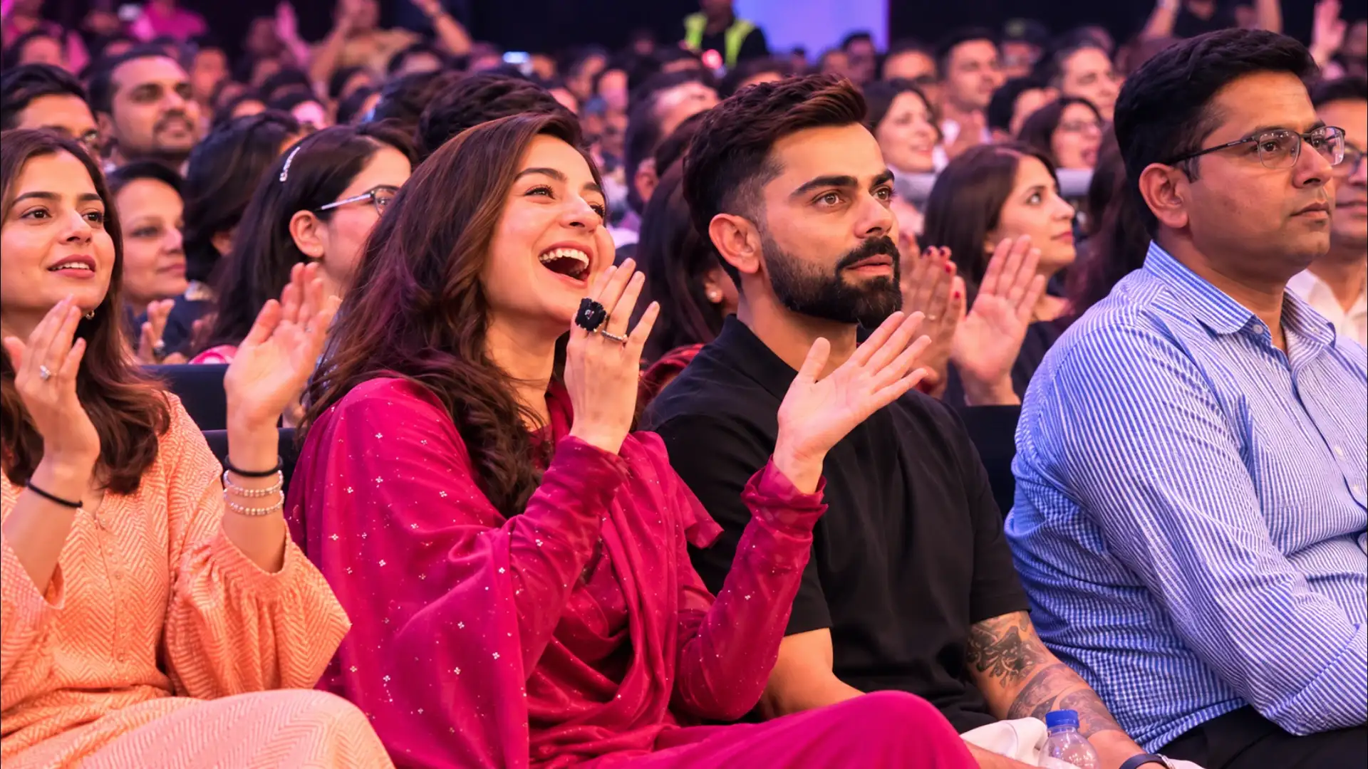 Joyful Applause at a Vibrant Stage Event
