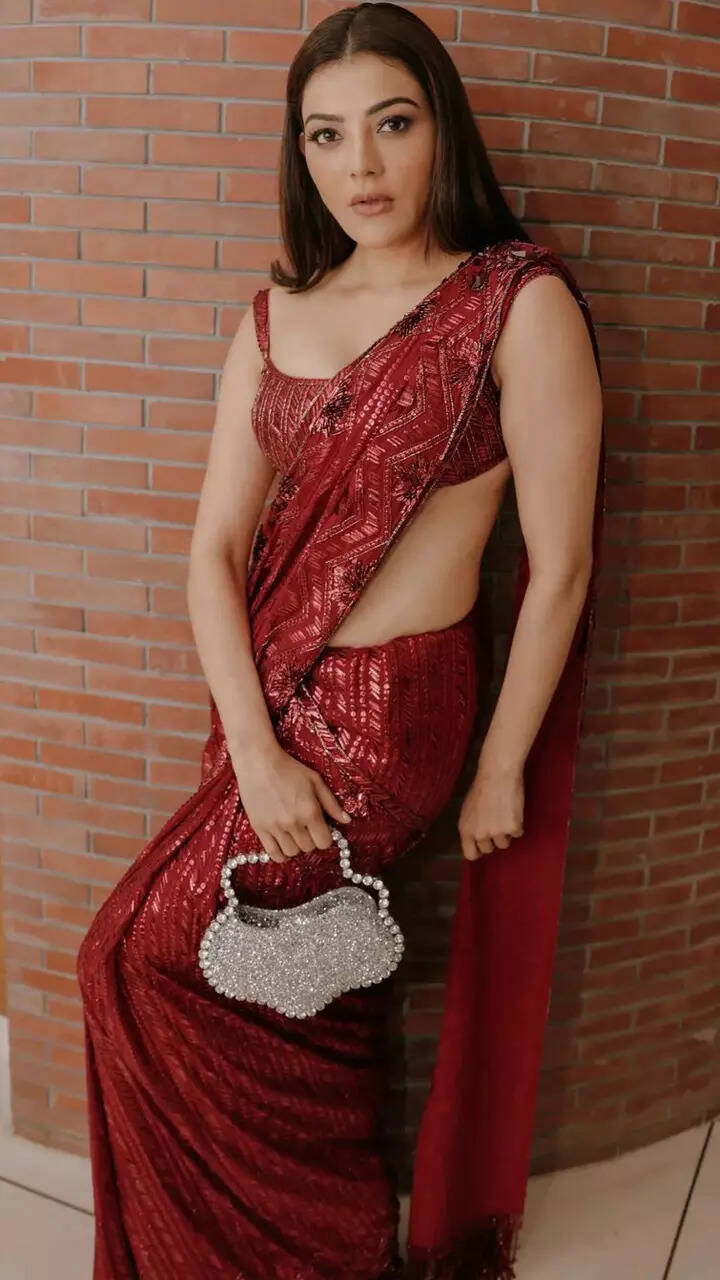 Kajal Aggarwal paints the town red in dazzling saree and flower-shaped  statement purse | TOIPhotogallery