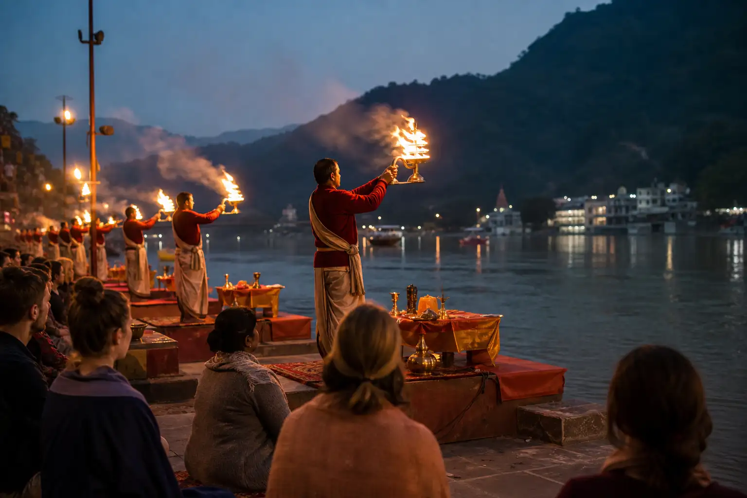 Participants witnessing evening Ganga Aarti on the river ghats