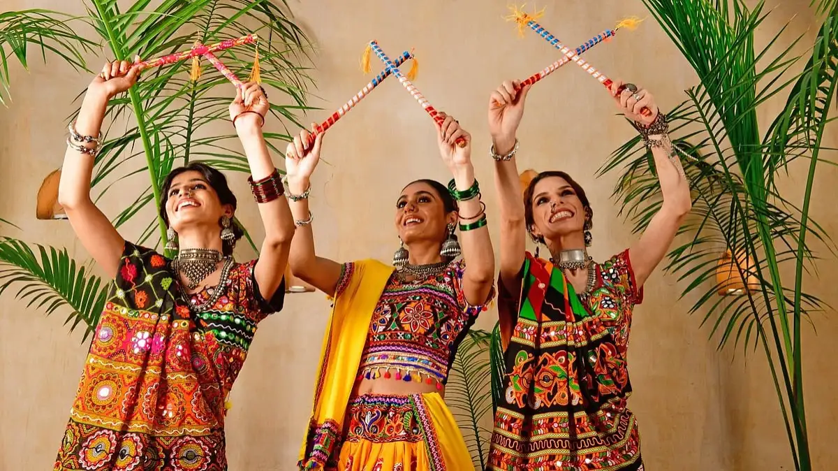 Dandiya dancers holding colourful sticks