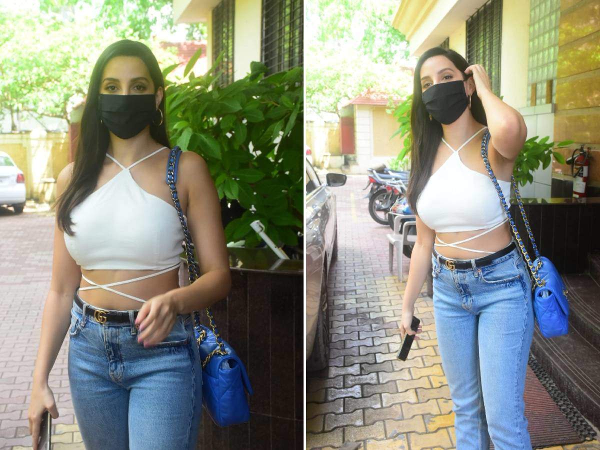 Nora Fatehi pairs ₹4 lakh bag with chic white crop top and denims