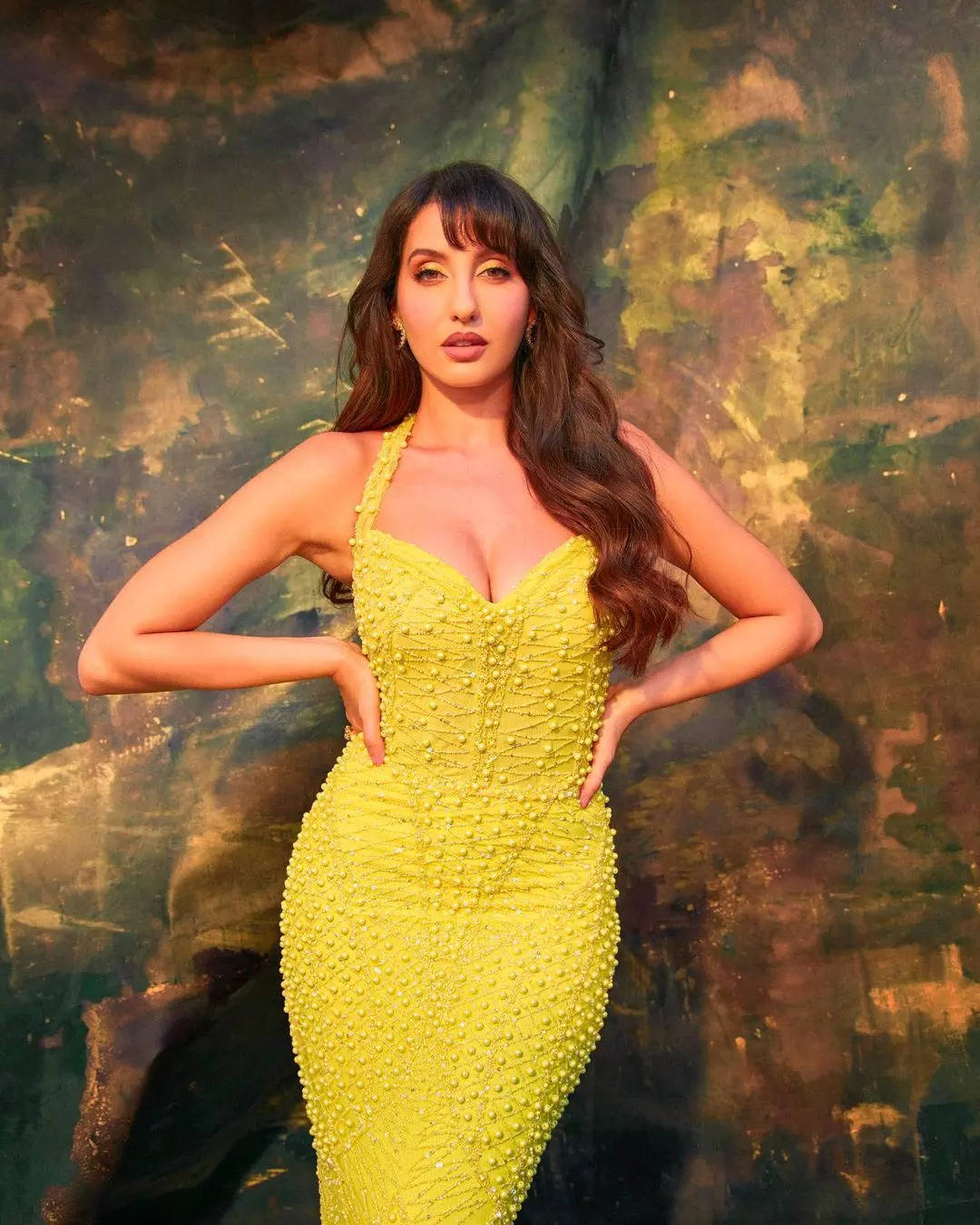 Nora Fatehi pairs sexy neon yellow bodycon dress with ₹3 lakh bag for shoot