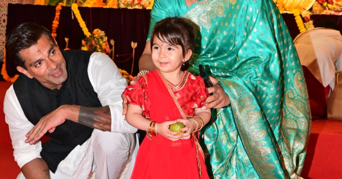 Bipasha Basu Daughter Devi Charms in a Red Lehenga for Durga Puja