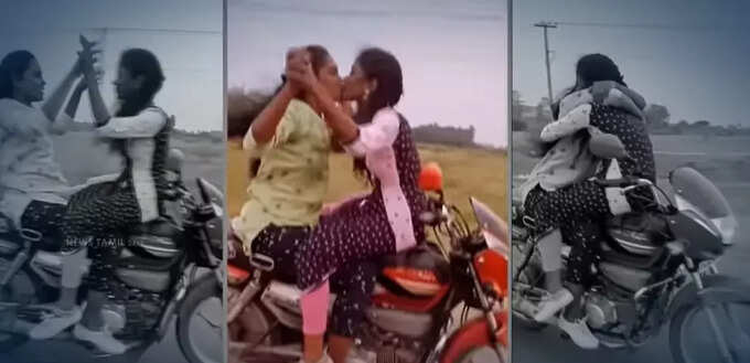 two girls kiss bike