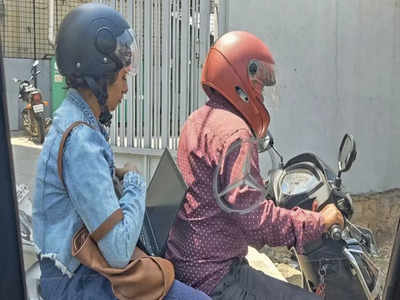 Viral News: যানজটে অফিস পৌঁছতে দেরি! স্কুটারের পিছনে বসেই ল্যাপটপে কাজ তরুণীর