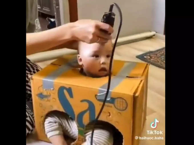 बच्चे को बॉक्स में बैठाकर काटे उसके बाल