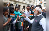 ​Modi in Paris: শিশুর গাল টিপে আদর, আবদার মেটালেন সেলফির, প্যারিসে পা দিয়েই অনাবাসীদের মন জয় মোদীর