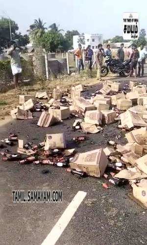 a cargo truck carrying liquor bottles got accident at tiruppur