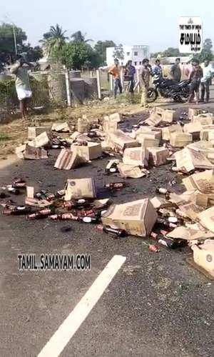 samayam/tamilnadu/tiruppur/a-cargo-truck-carrying-liquor-bottles-got-accident-at-tiruppur