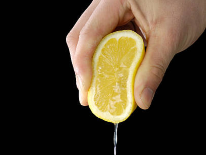 clean dirty oil bottle with lemon