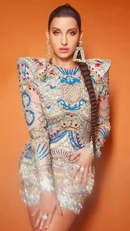 nora fatehi in short dress Nora Fatehi steps out in beige bodycon dress with a mini handbag :  Bollywood News