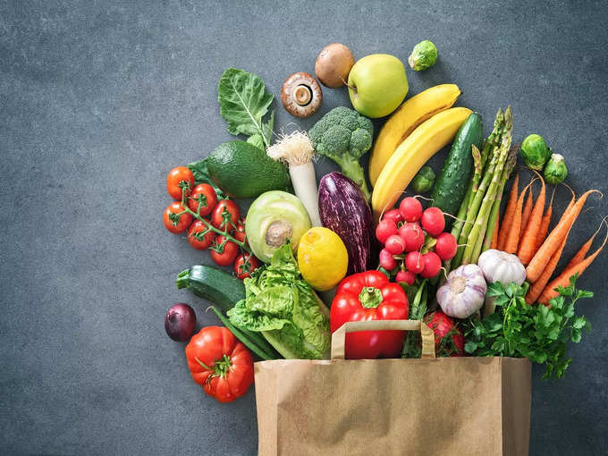 Shopping bag full of fresh vegetables and fruits stock photo