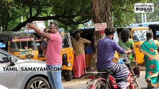 traffic police with his children clears traffic in tiruvarur