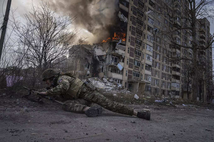 AP PHOTOS: Ukraine endures a second year of war with scenes of grief, suffering and also joy