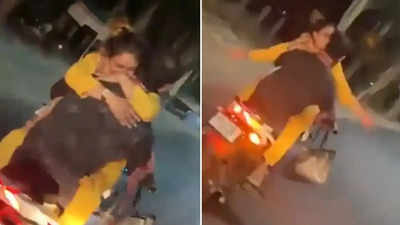 Viral Video: स्पीड में बाइक चलाते हुऐ कपल खुलेआम कर रहा था रोमांस, पुलिस ने पकड़ा और लिया जोरदार एक्शन