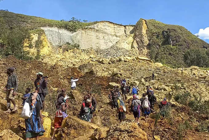 Australia plans to send aid to Papua New Guinea as rain raises safety fears at deadly landslide site.