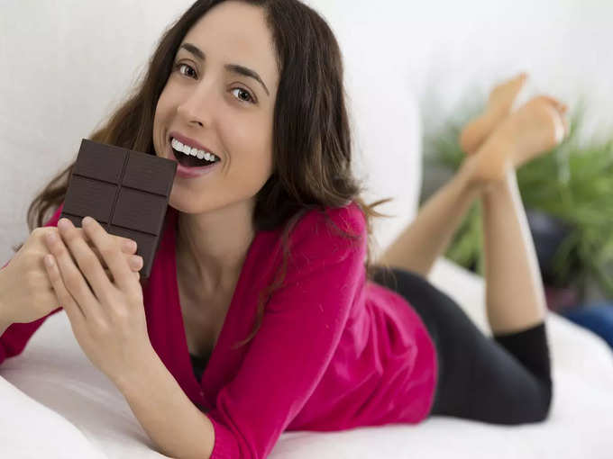 Eating chocolate stock photo