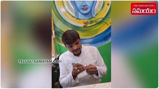 srikakulam artist creates micro sculpture of radha krishna on pencil lead on occasion of sri krishnashtami