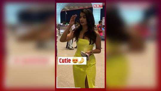 pooja hegde spotted at mumbai airport looked glamrous in yellow neon dress watch video