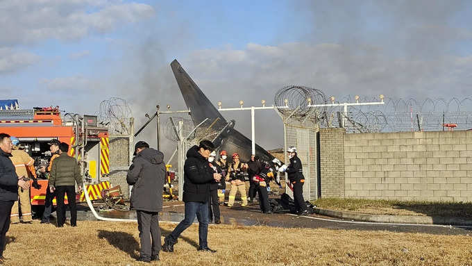 Plane burst into flames after skidding off runway at an airport in South Korea, killing at least 120