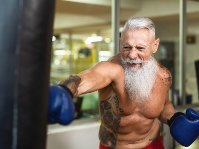 muscular man boxing exercise senior citizen fit white beard white hair