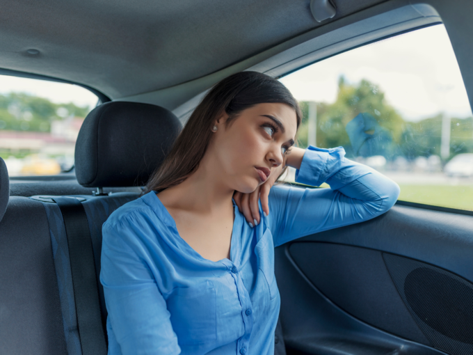 sad depression stress girl sitting in car window seat