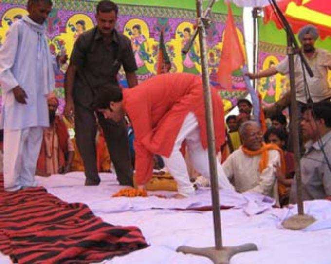 BJP leader Varun Gandhi mounts the stage before it collapses, during an election meeting in Pilibhit on Friday 
