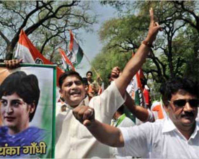 Indias Congress Party supporters celebrate their party lead in national elections