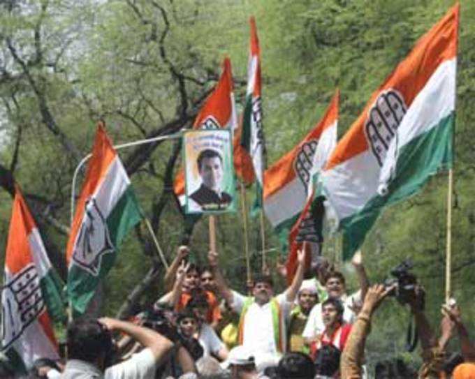 Indias Congress Party supporters celebrate their party lead in national elections
