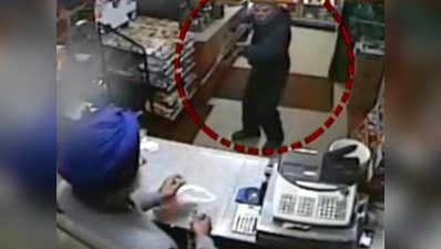 Caught on cam: Sikh shopkeeper fights-off armed robber with slipper 