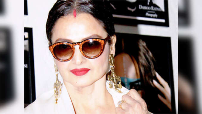 Rekha spotted at a calendar launch, but refuses to interact with media 