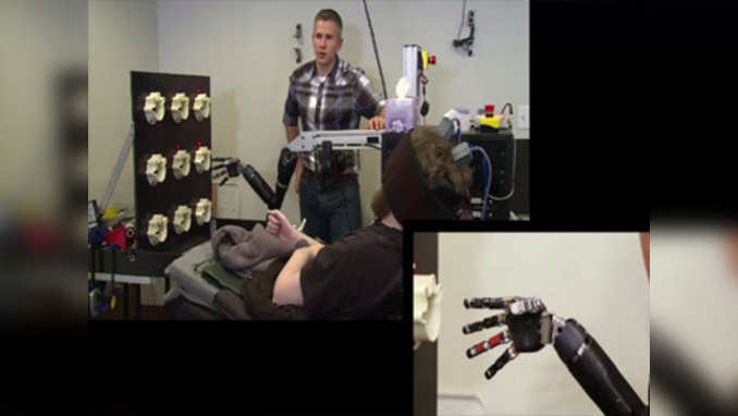 Mind-controlled robot arm gives back sense of touch to paralysed man 