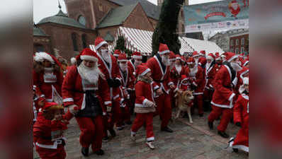 Hundreds don Santa Claus suits for charity run 