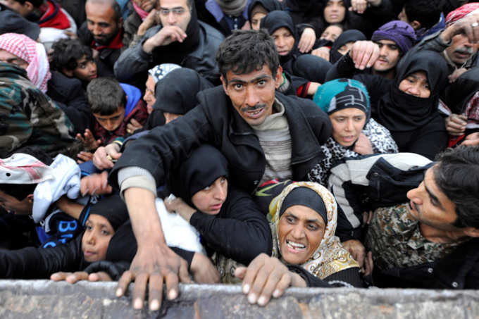 Evacuated civilians waiting for food aid111111