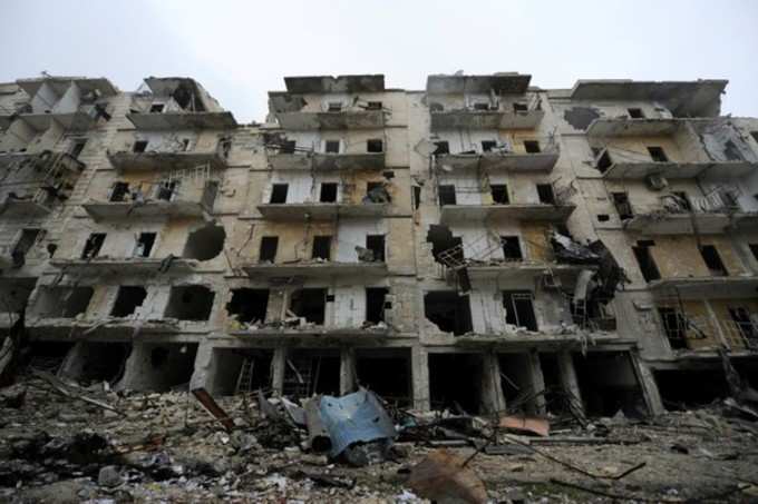 Damaged buildings in the government held Al-Shaad part of the city