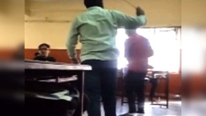 Watch: College lecturer thrashes students for delay in homework 