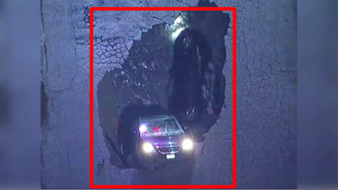 On cam: Massive sinkhole swallows two vehicles 