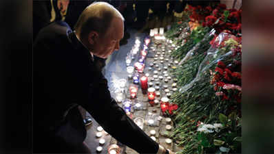 Putin lays flowers at Russian blast site 