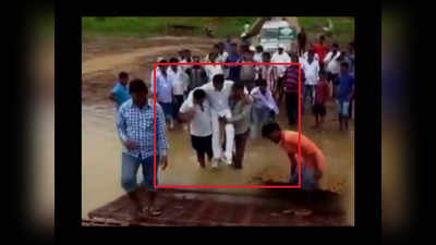 On cam: BJD MLA crosses muddy stretch in supporters arms 