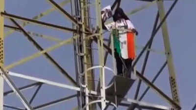 Watch: Congress worker climbs up tower 