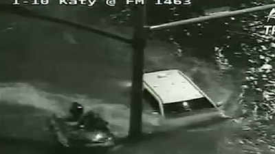 On cam: Driver rescued from submerged SUV 