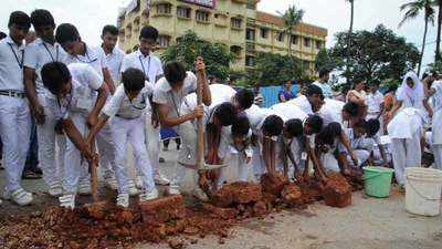 Students take up the task to fill potholes on highway in Mangaluru 