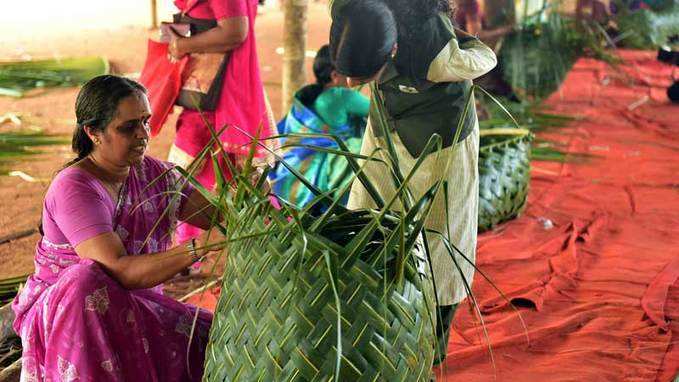 Kudumbasree workers take part in coconut leaf basket braiding competition 