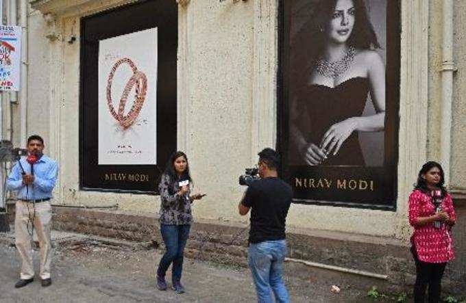 Mumbai: Media persons outside a Nirav Modi jewellery showroom at Kala Ghoda in M...