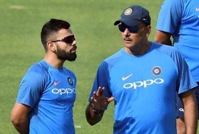 Kolkata: Indian captain Virat Kohli with coach Ravi Shastri during a training se...