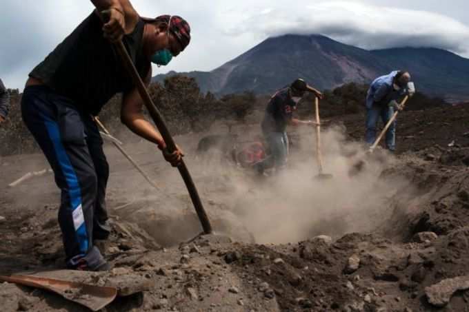 In-Guatemala-woman-searches-for-50-relatives-buried-by-volcano-