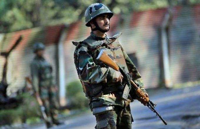 Jammu: Indian army jawan during a search operation outside the army camp in Jamm...