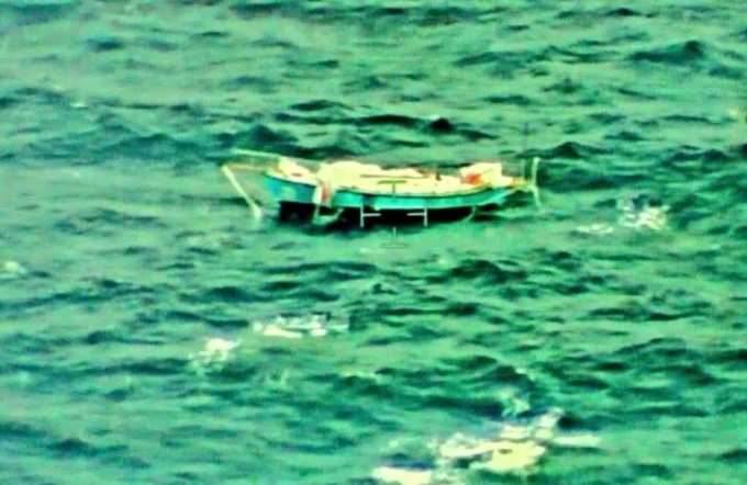 Indian Navy handout photo shows the capsized yacht Thuriya of solo sailor Abhilash Tomy at sea