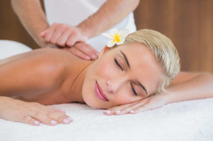 woman-receiving-back-massage-spa-center_13339-205182