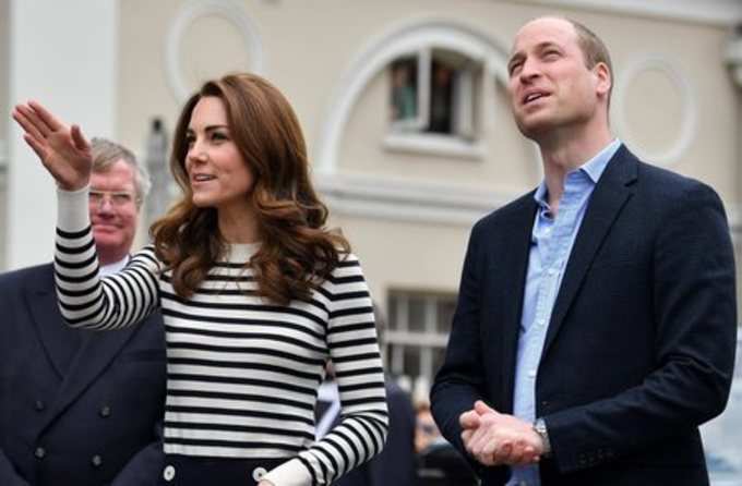 London: Britain&#39;s Prince William and Kate, Duchess of Cambridge look towards the...